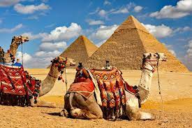 Placeholder image of a tour group in front of the Giza pyramids with camels